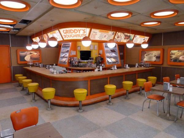 The Umbrella Academy production design | The Umbrella Academy set design | The Umbreela Academy sets | The Umbrella Academy design | Griddy's Doughnuts | Orange Donut Shop | Season 1