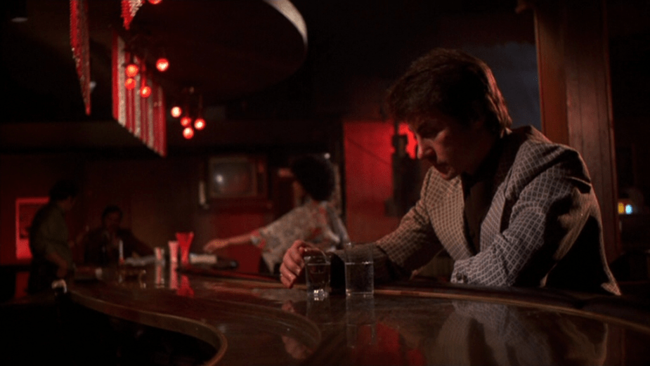 Mean Streets (1973) | Martin Scorsese production design | Martin Scorsese Films | Harvey Keitel sitting at bar with red lighting