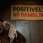 Mean Streets (1973) | Martin Scorsese production design | Martin Scorsese Films | Robert DeNiro icing his eye after a fight standing beside Positively No Gambling sign
