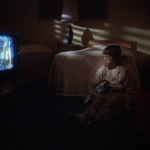 Alice Doesn't Live Here Anymore (1974) | Martin Scorsese production design | Martin Scorsese Films | Ellen Burstyn's son, the young boy, watches TV in bedroom