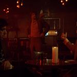 Mean Streets (1973) | Martin Scorsese production design | Martin Scorsese Films | The guys talking at a table at the bar with Robert DeNiro standing nearby