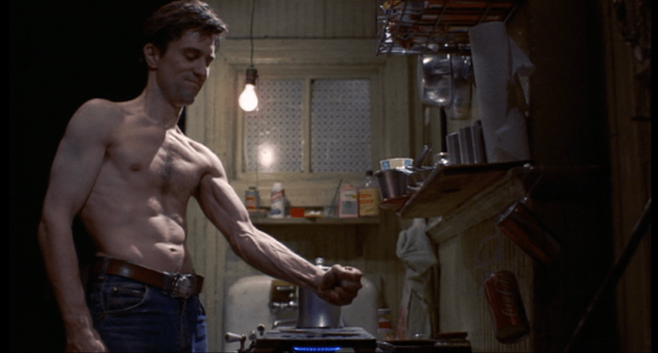 Taxi Driver (1976) | Martin Scorsese production design | Martin Scorsese Films | Robert DeNiro clenching fist over stove in kitchen
